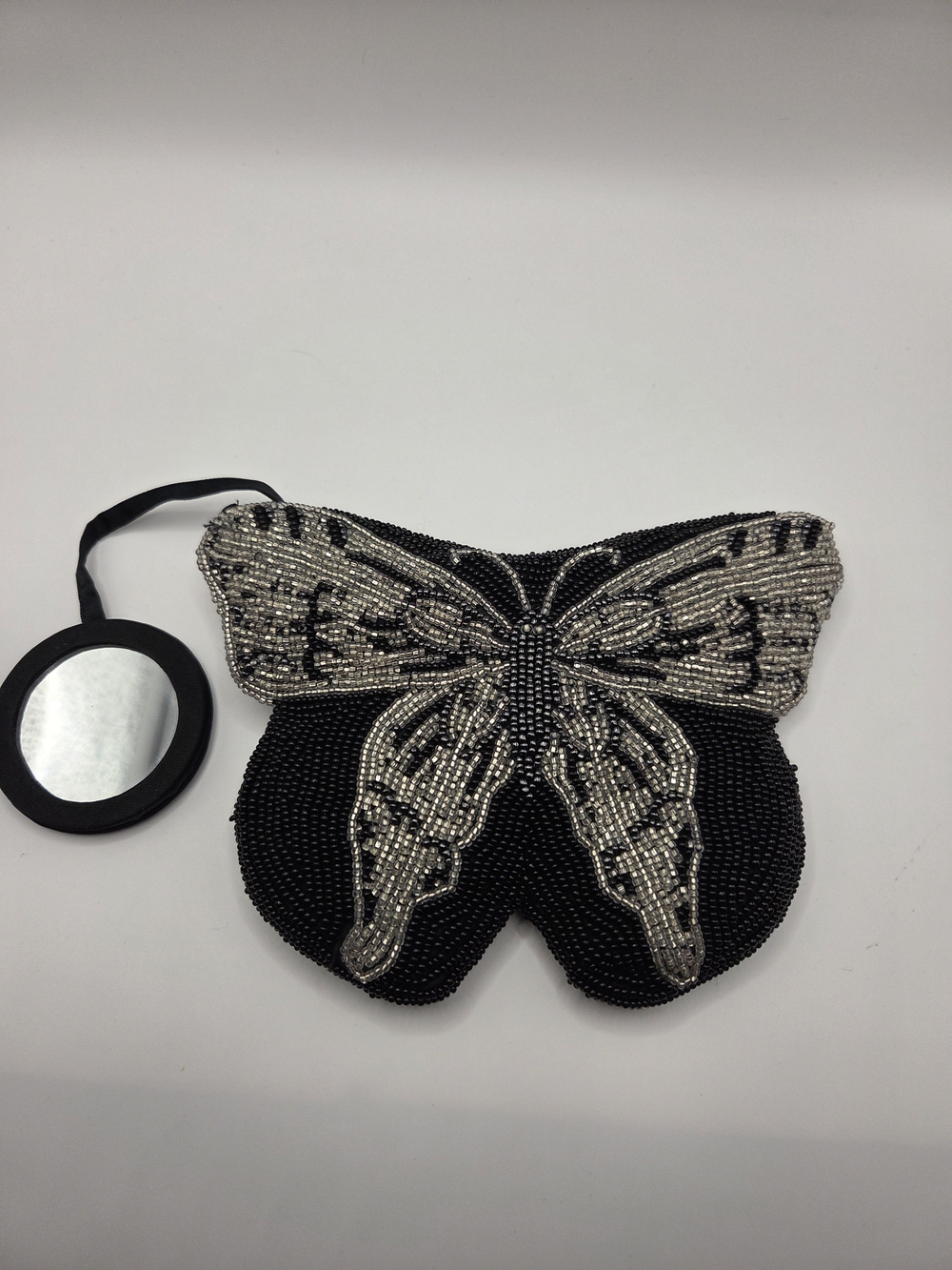 P110. Neiman Marcus Black and Silver Beaded Butterfly Clutch
